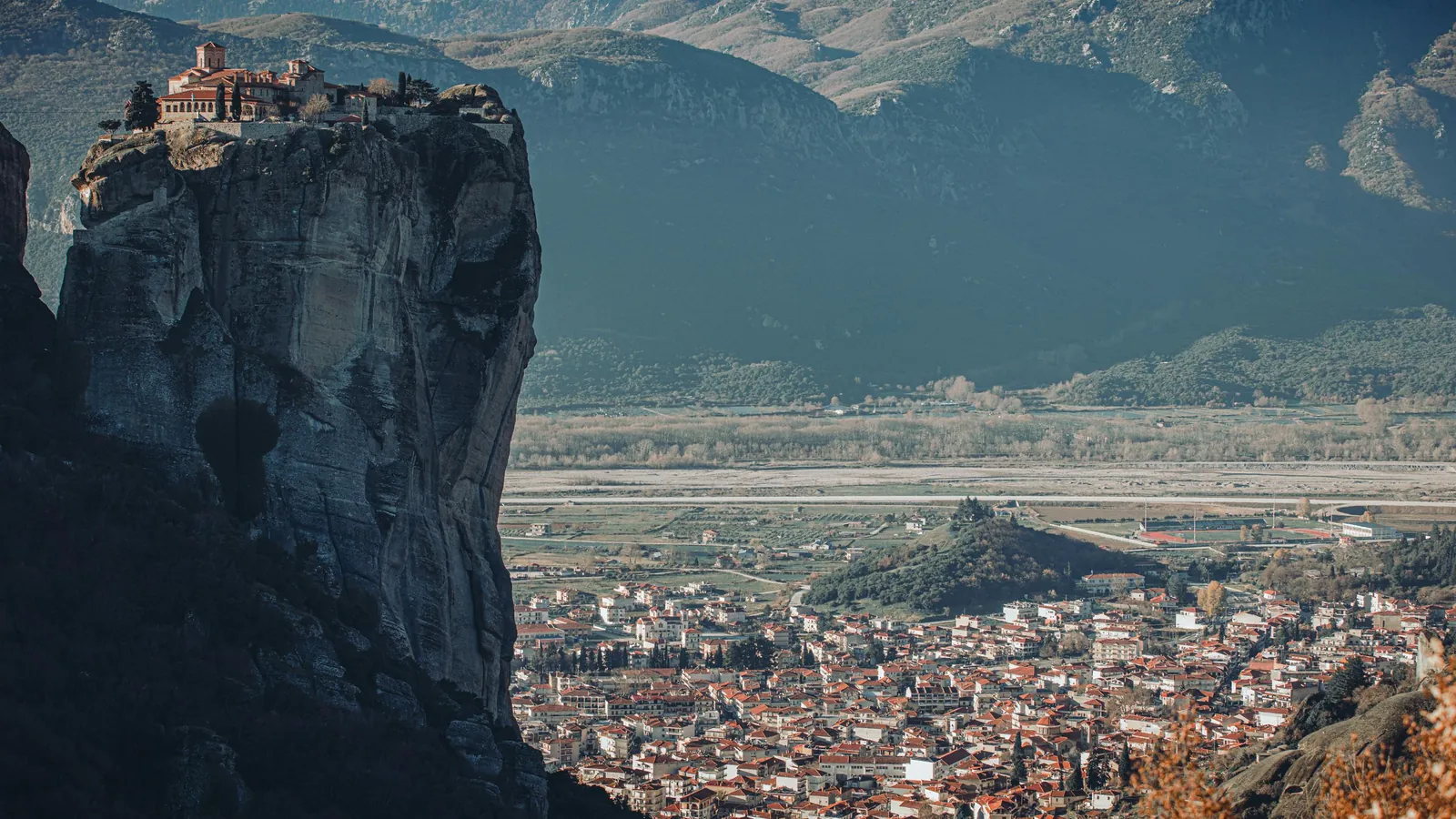 Holy Trinity monastery on its dramatic pillar with Kalambaka in the valley below