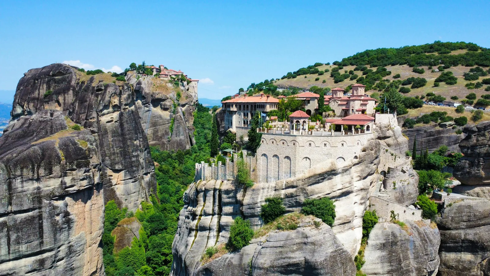Varlaam monastery on a sandstone pillar with rocky valley views, Meteora, Greece